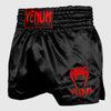 Venum Pantalones cortos clásicos de muay thai negro/rojo