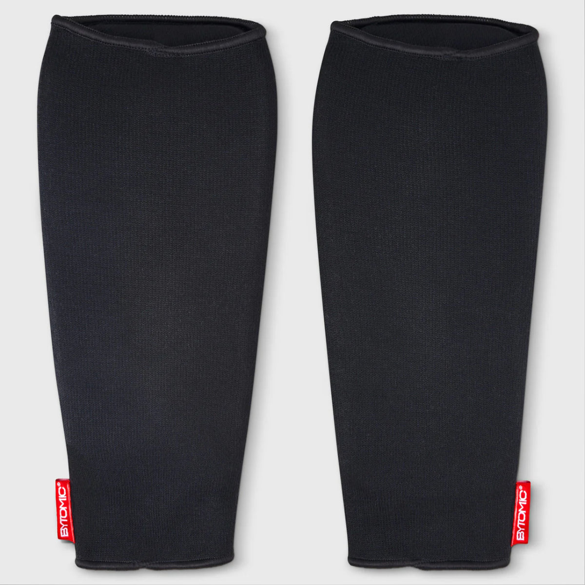 Etiqueta roja bytómica Guardias de espinilla elástica Negro/Blanco