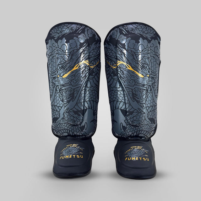 Fumetsu Dragon Slayer Shin Guards Black/Gold