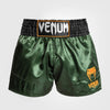 Venum Pantalones cortos clásicos de muay thai verdes/negros/dorado