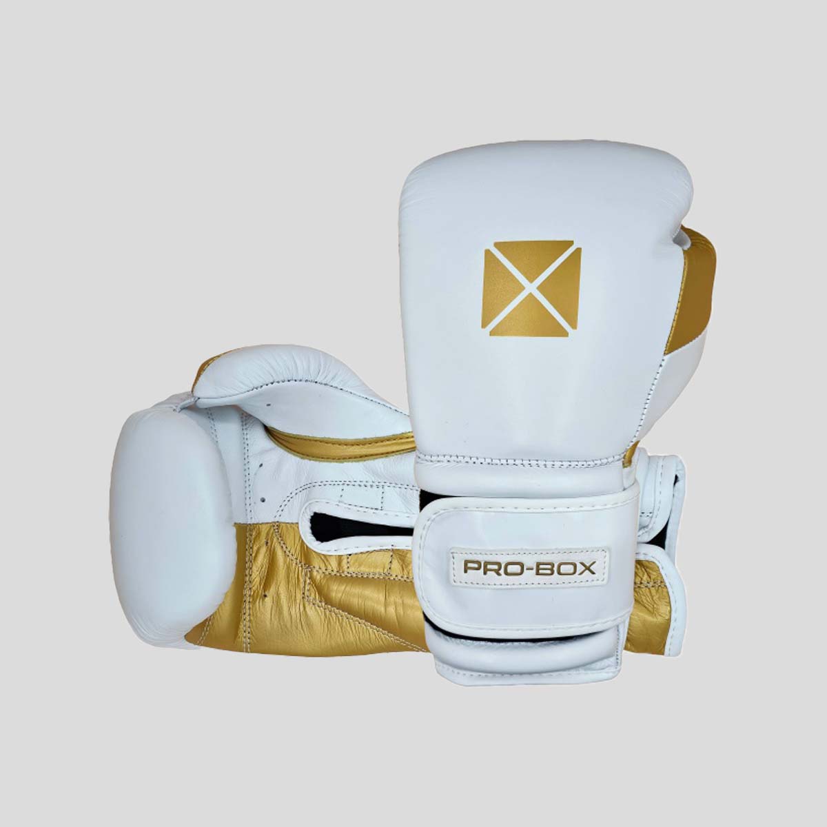 قفازات ملاكمة للملاكمة من الجلد المؤيدة للربع الأبيض/الذهب (جديد)