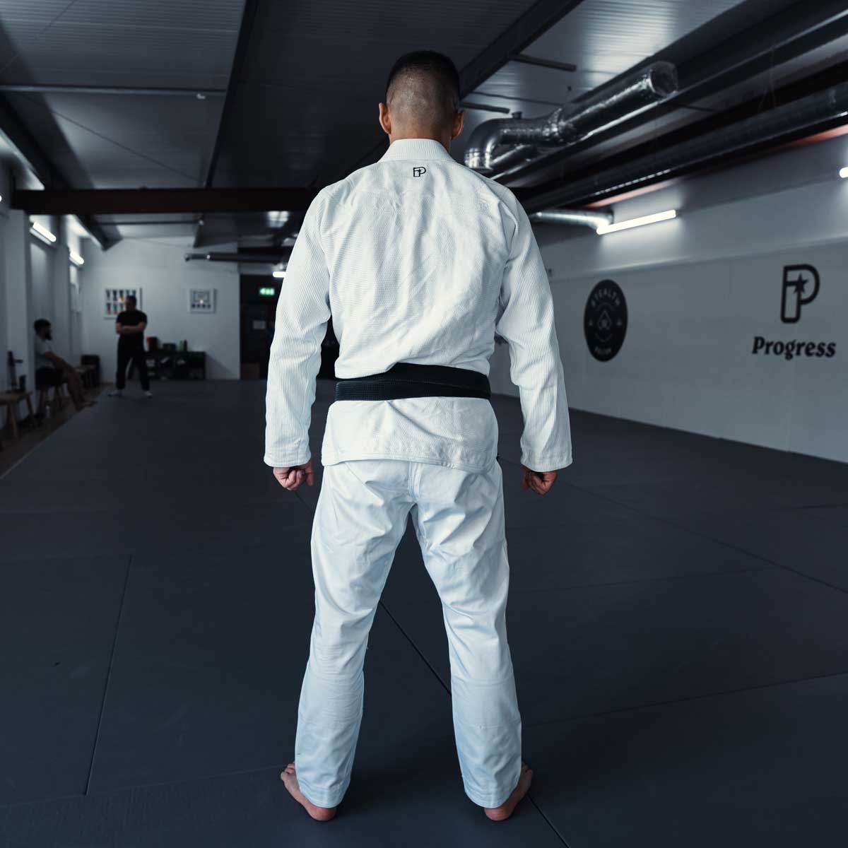Fremgang stiftelsen tre BJJ Gi White