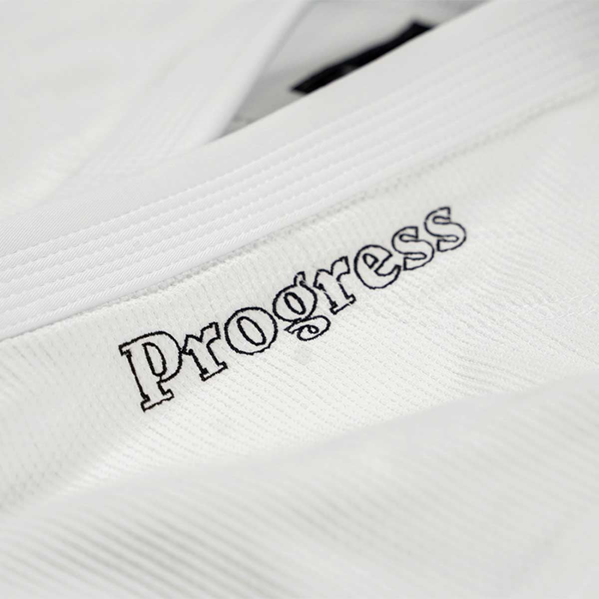 Fremgang stiftelsen tre BJJ Gi White