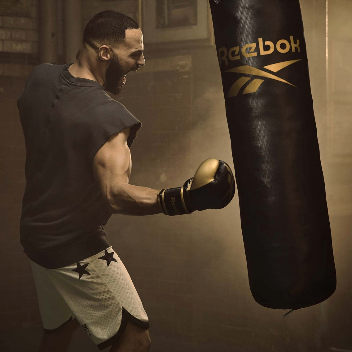 Reebok 4ft PU Punch Bag Black/Gold   