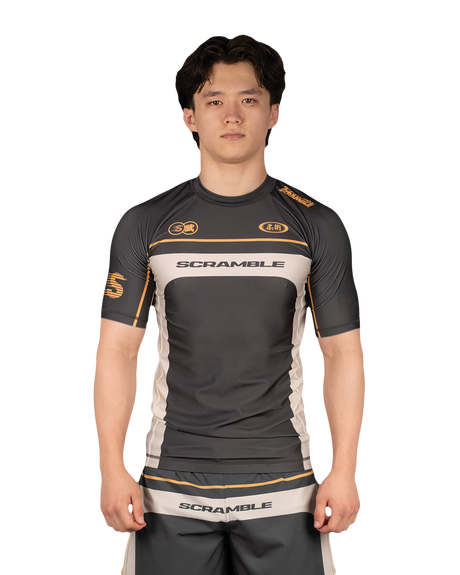 Scramble Duotone Rash Guard Black in black, stone and orange, front view