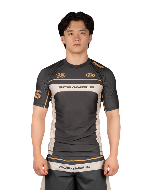 Scramble Duotone Rash Guard Black in black, stone and orange, front view