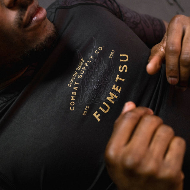 Fumetsu Dragon Slayer Short Sleeve Rash Guard Black/Gold