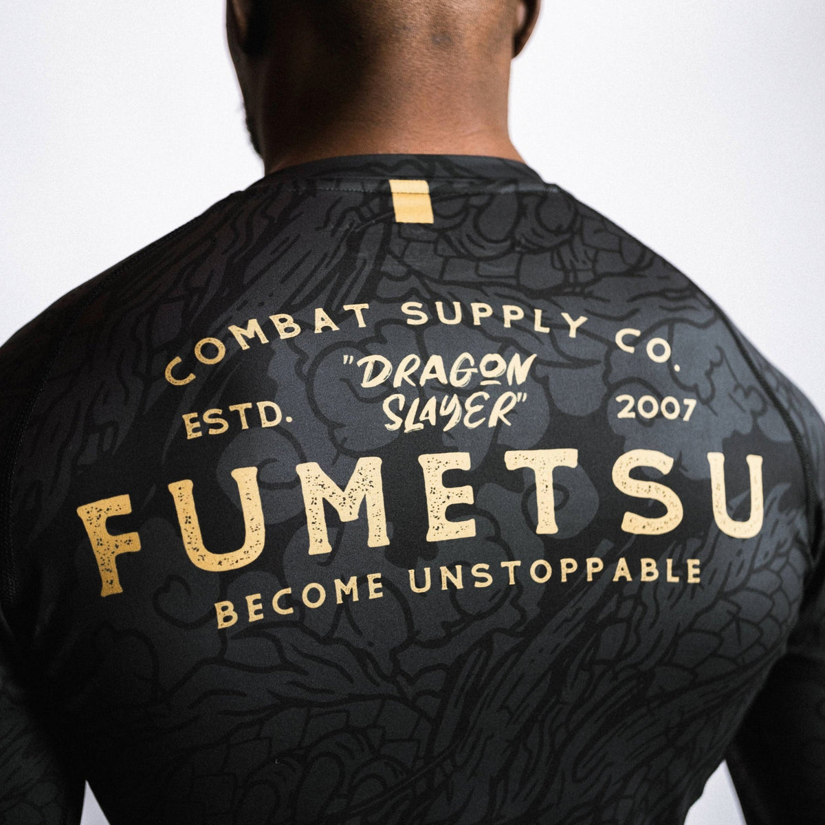 Slayer Rash Guard Fumetsu Dragon Slayer Long Sleeve Rash Guard Black/Gold from Made4Fighters