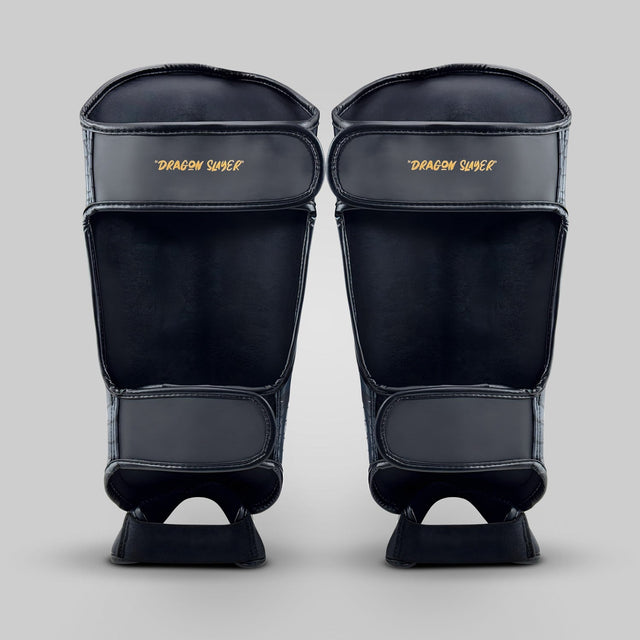 Fumetsu Dragon Slayer Shin Guards Black/Gold