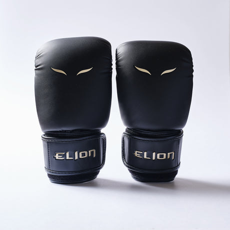 Elion Bag Gloves Black/Gold pair front with gold ELION logo