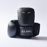 Elion Bag Gloves Black/Gold angled view with gold detailing