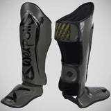 8 हथियार असीमित शिन गार्ड जैतून/काला