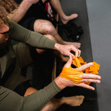 Fumetsu -ikonen hand wraps orange