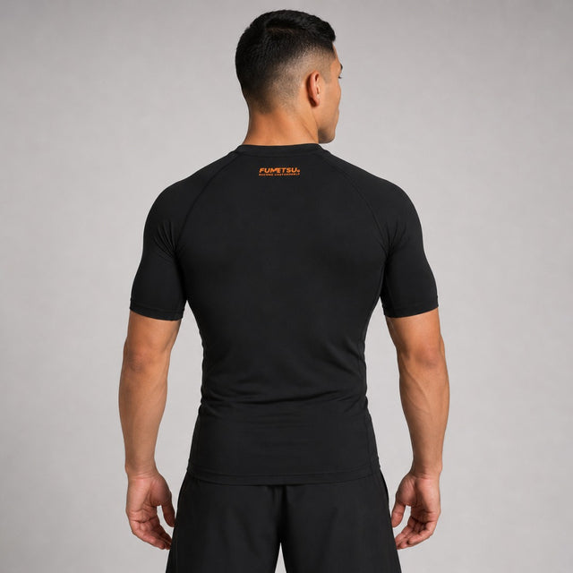 Fumetsu Origins Short Sleeve Rash Guard Black/Orange