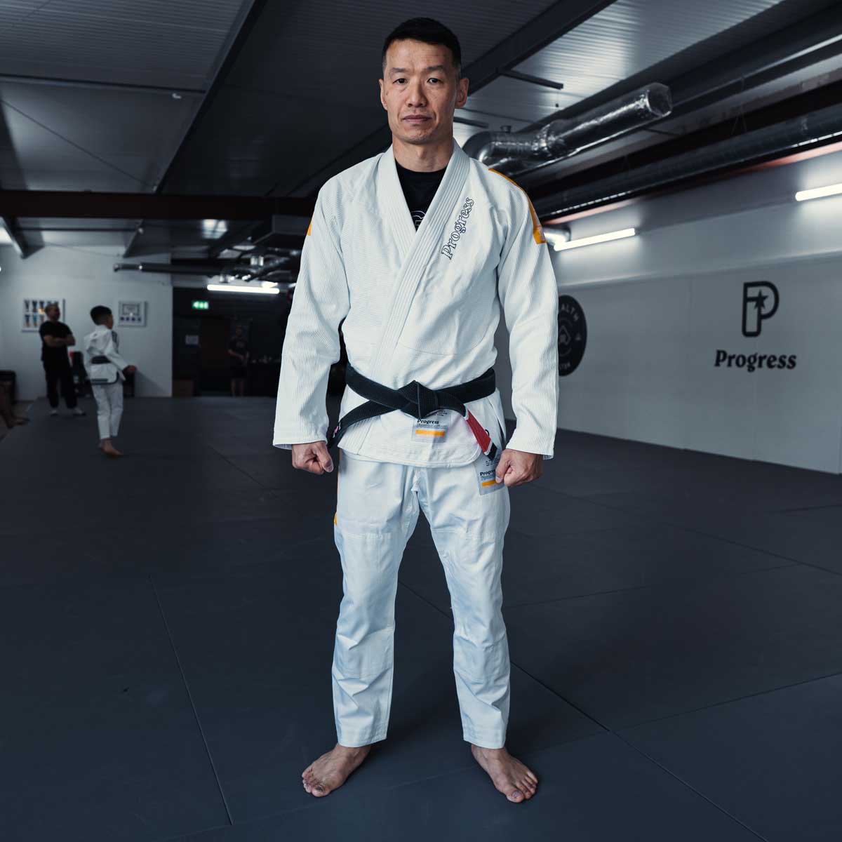 Fremgang stiftelsen tre BJJ Gi White