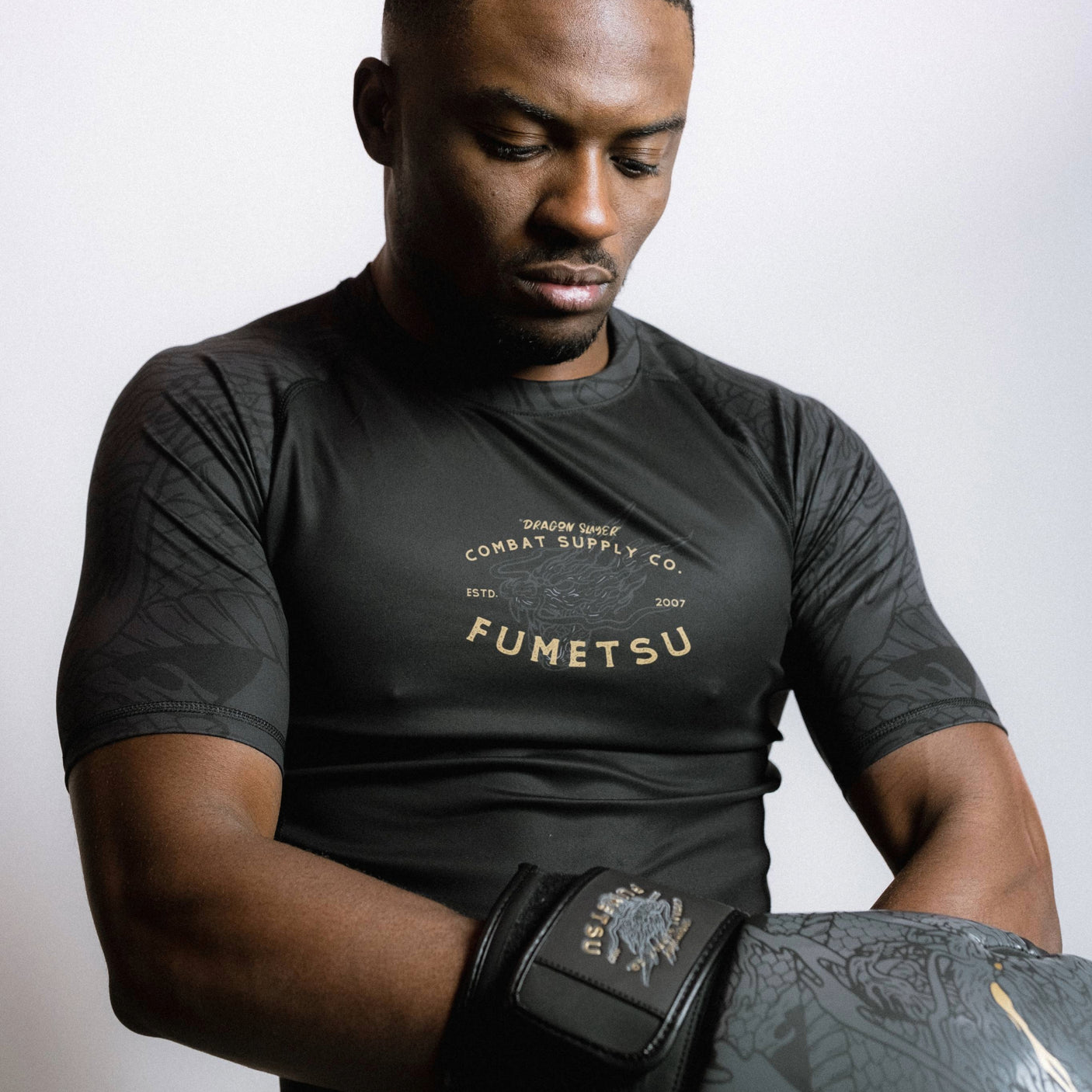 Fumetsu Dragon Slayer Short Sleeve Rash Guard Black/Gold