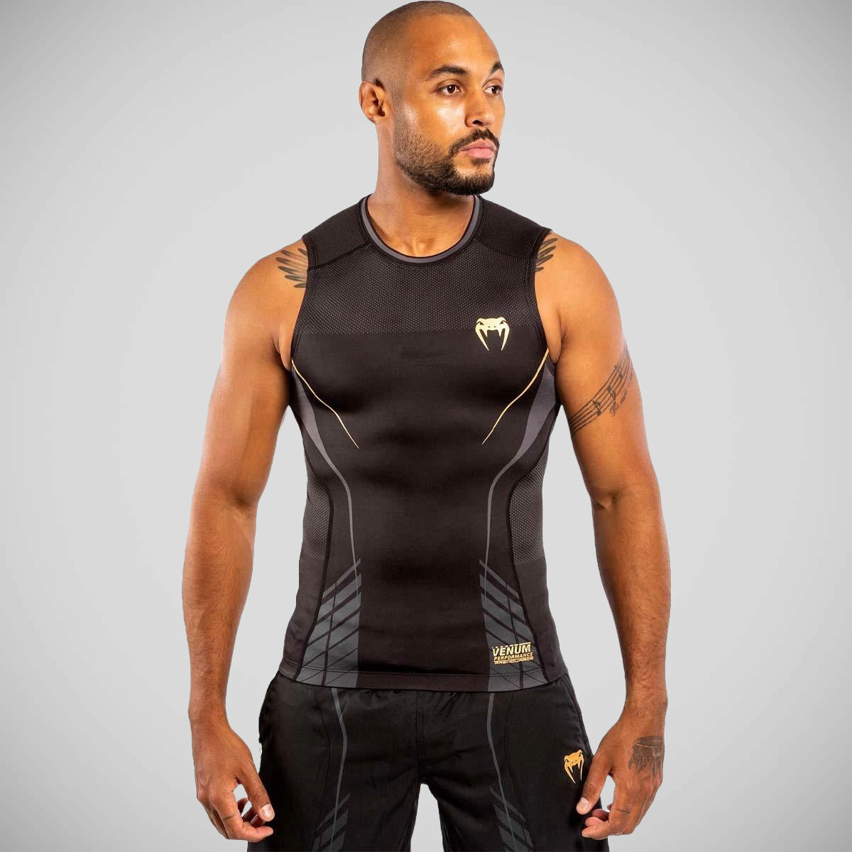 Black-Gold Venum Athletics Sleeveless Rash Guard from Made4Fighters