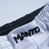 Shorts de luta de fluxo de Manto
