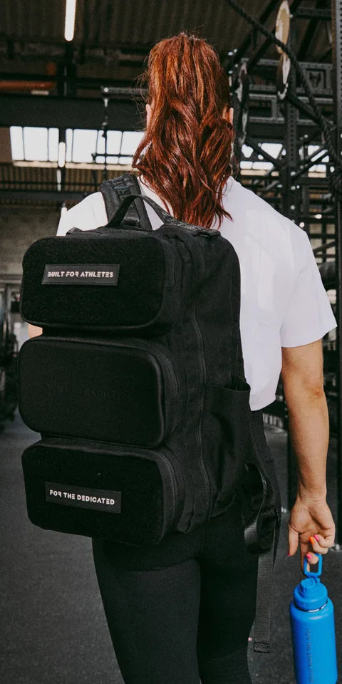 Athlete carrying a Built for Athletes backpack