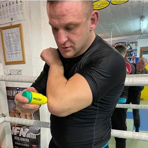 Combat athlete with Namman Muay cream at the gym