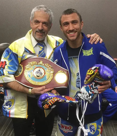Rival boxer and coach celebrating a championship